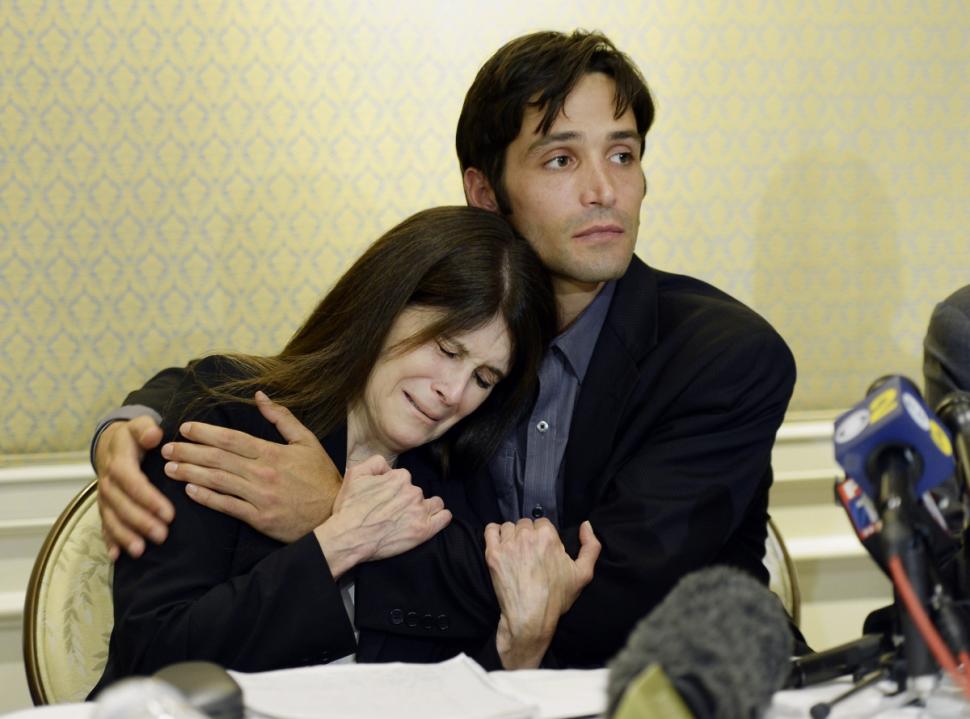 Michael Egan (right), who sued filmmaker Bryan Singer for allegedly raping him as a teenager, comforts his mother Bonnie Mound during a news conference at a hotel in Los Angeles on April 21.
