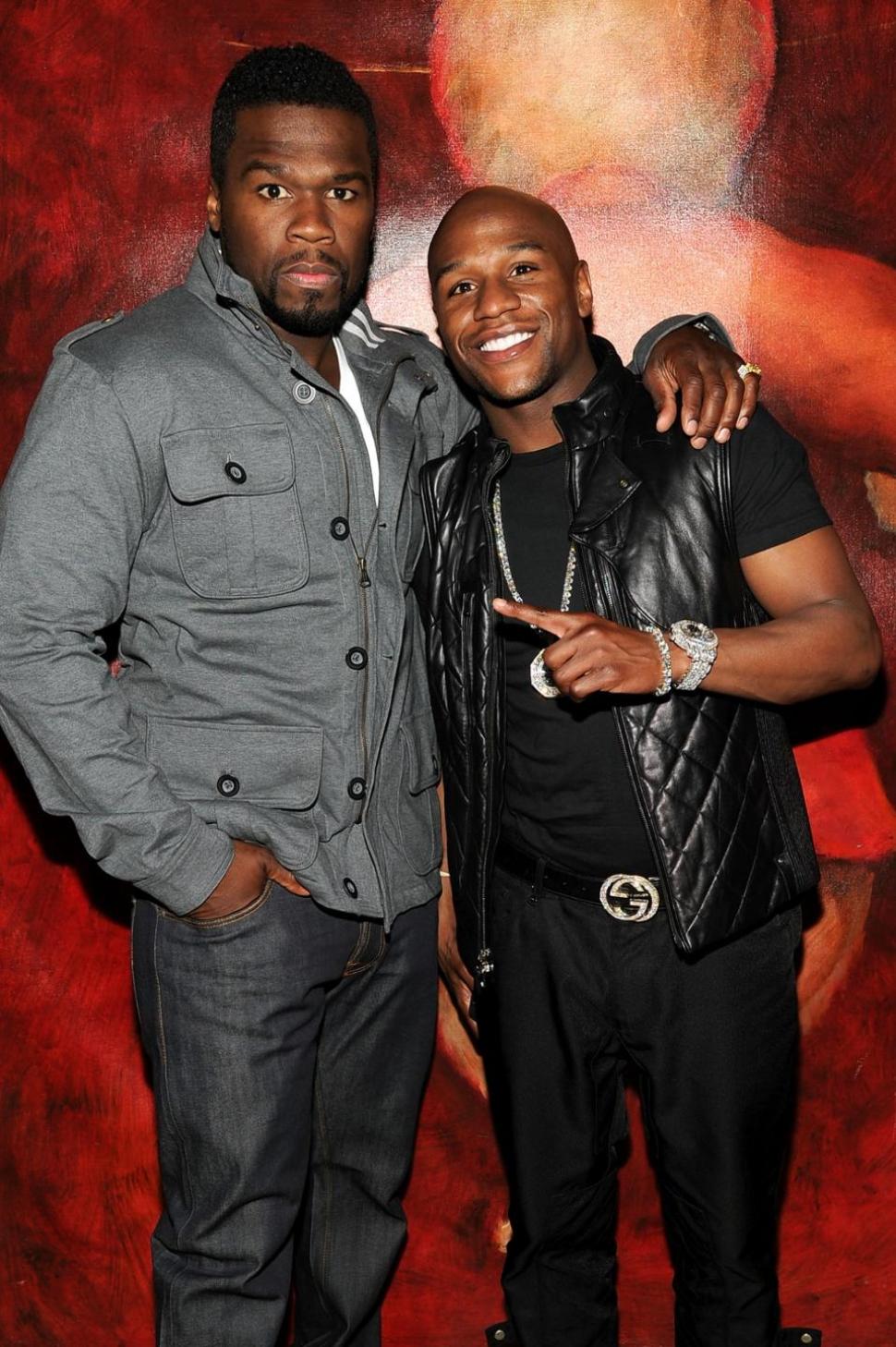 Happier times: 50 Cent has feuded for days with Floyd Mayweather Jr., mocking the champ as illiterate.