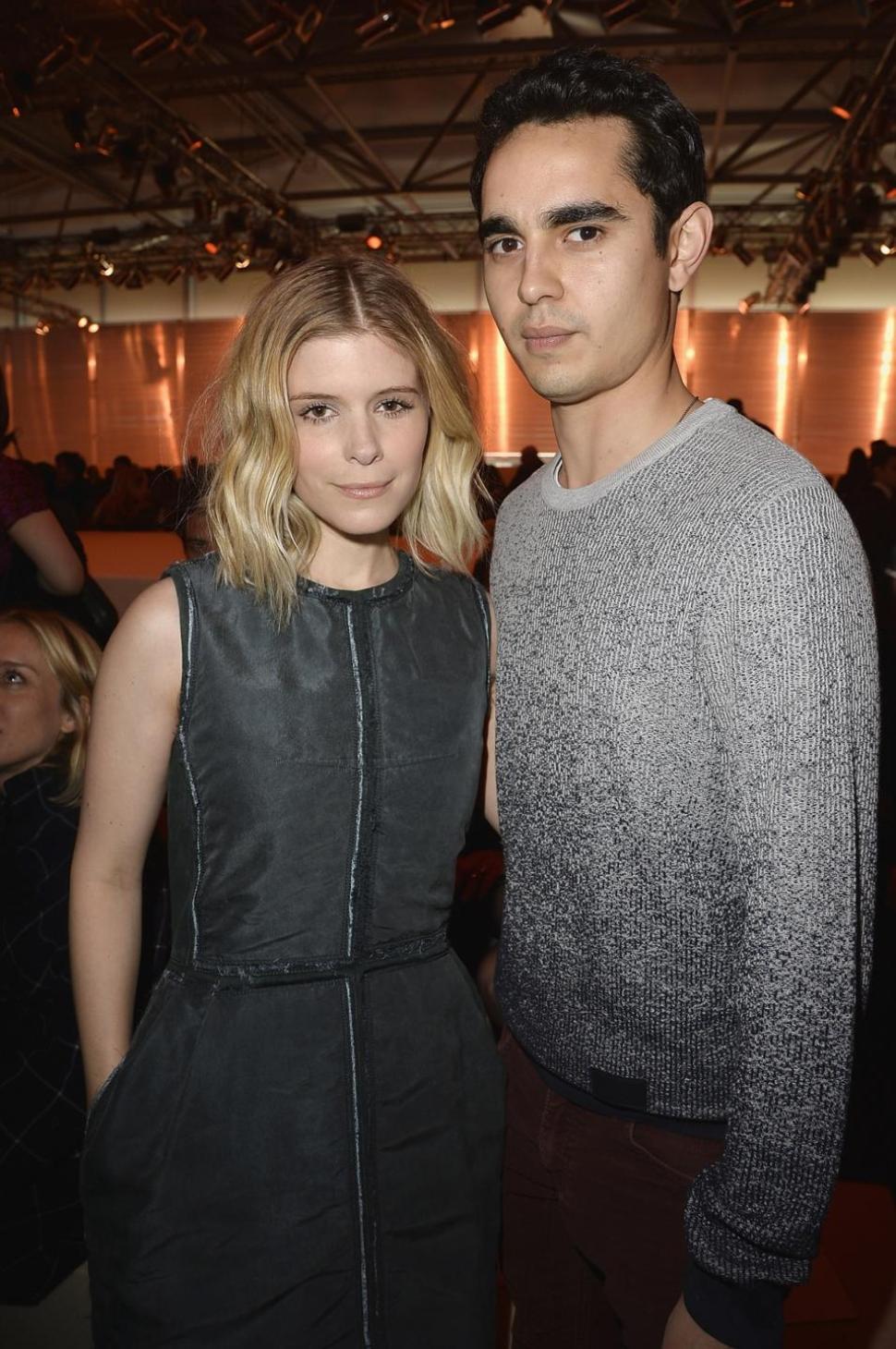 Kate Mara and boyfriend Max Minghella attend the Louis Vuitton show at Paris Fashion Week in March 2014. The two have reportedly called it quits after four years together.