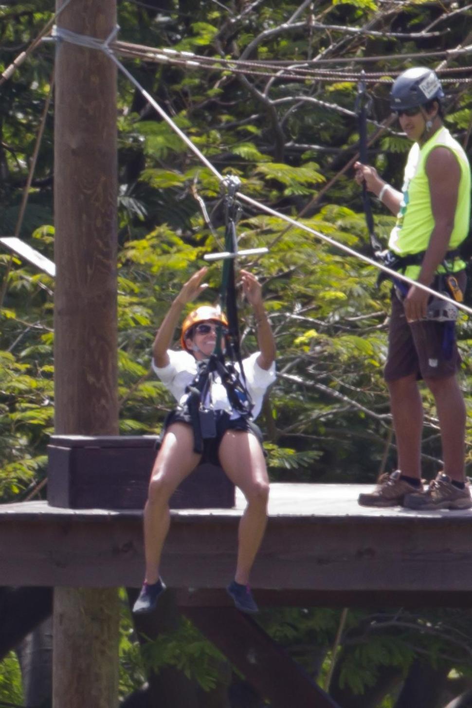Halle Berry defies gravity zip-lining in Hawaii.
