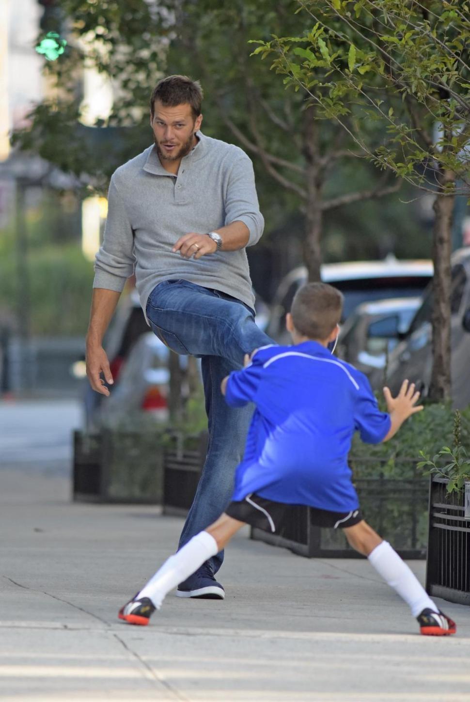 Tom Brady and son Jack are just kickin' it in the West Village.