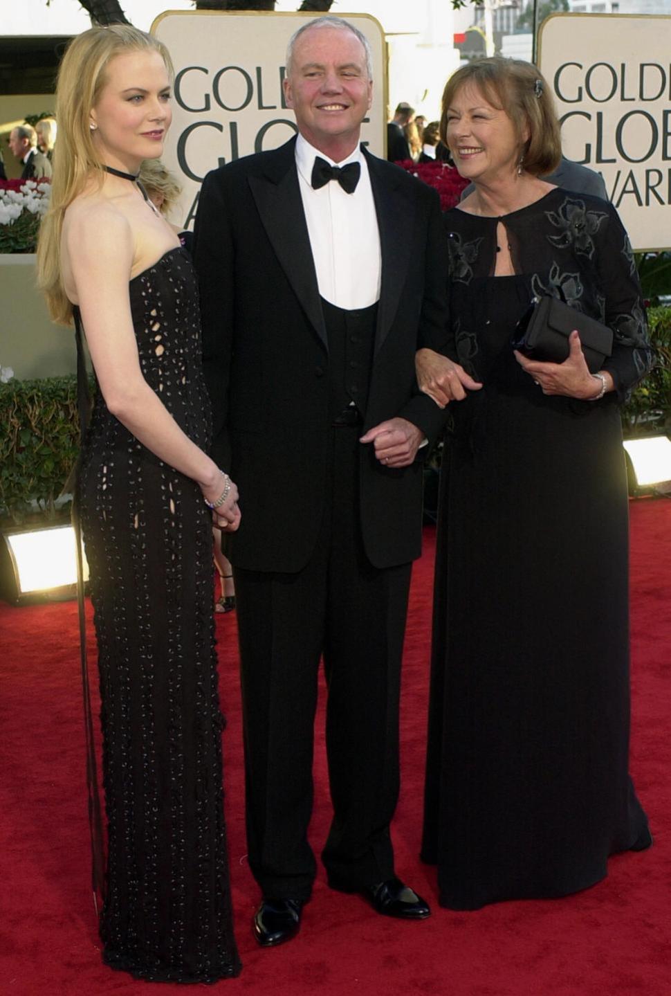 Australian actress Nicole Kidman, left, arrives with her parents Anthony and Janelle, at the 59th Annual Golden Globe Awards in 2002.