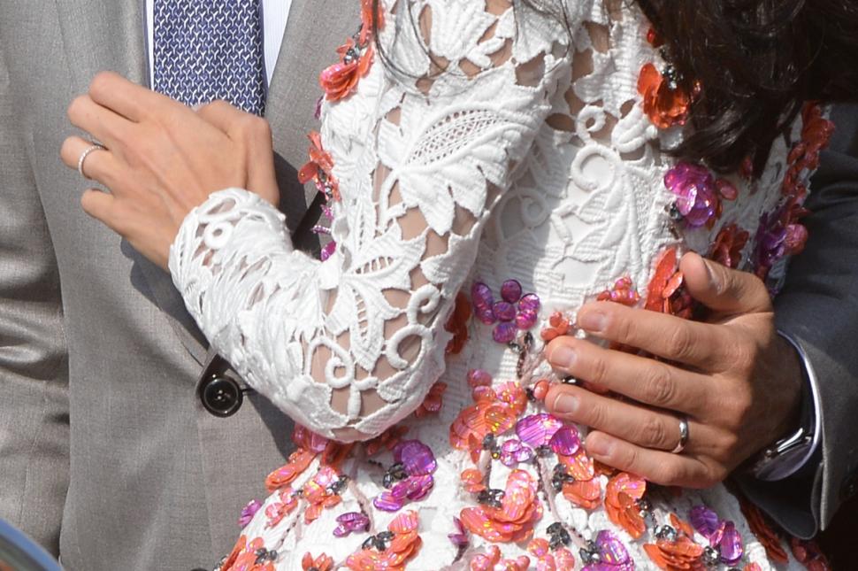 Bling rings: Clooney and Alamuddin wore striking new wedding bands.