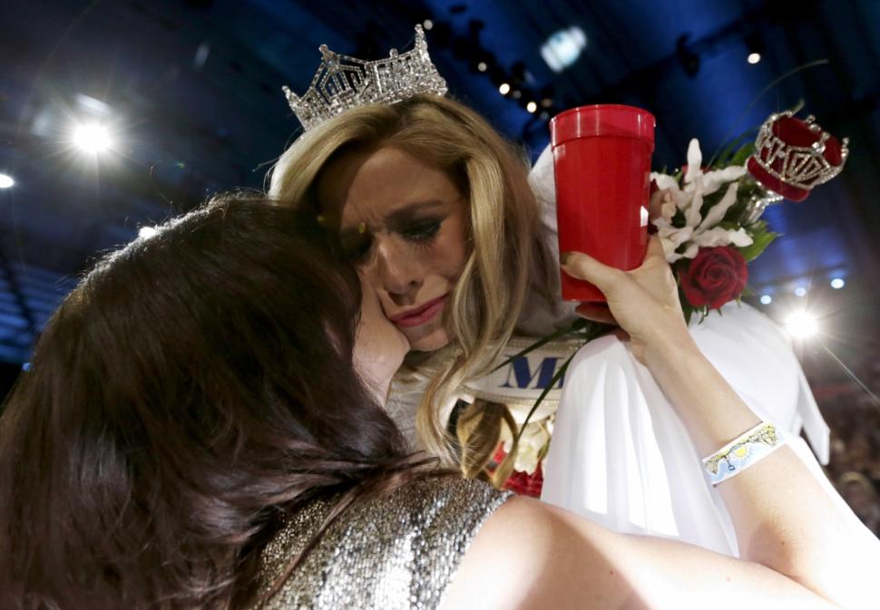 Miss New York Kira Kazantsev, right, gets a kiss from her mother, Julia Kazantsev, after she was crowned Miss America 2015 on Sunday.