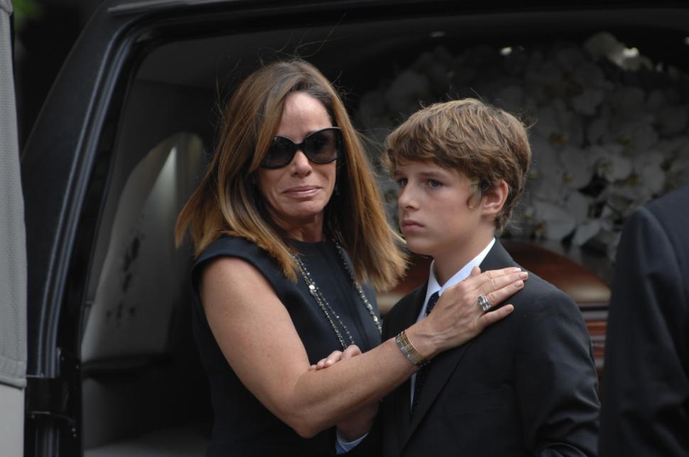 Melissa Rivers and her son Cooper bid farewell to Joan Rivers as her body leaves the Frank Campbell funeral home.