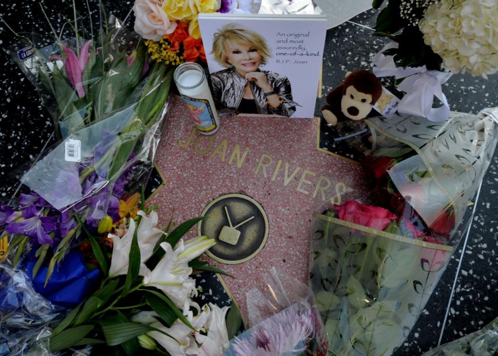 Flowers are placed on the Hollywood Walk of Fame Star for Joan Rivers upon news of her death.
