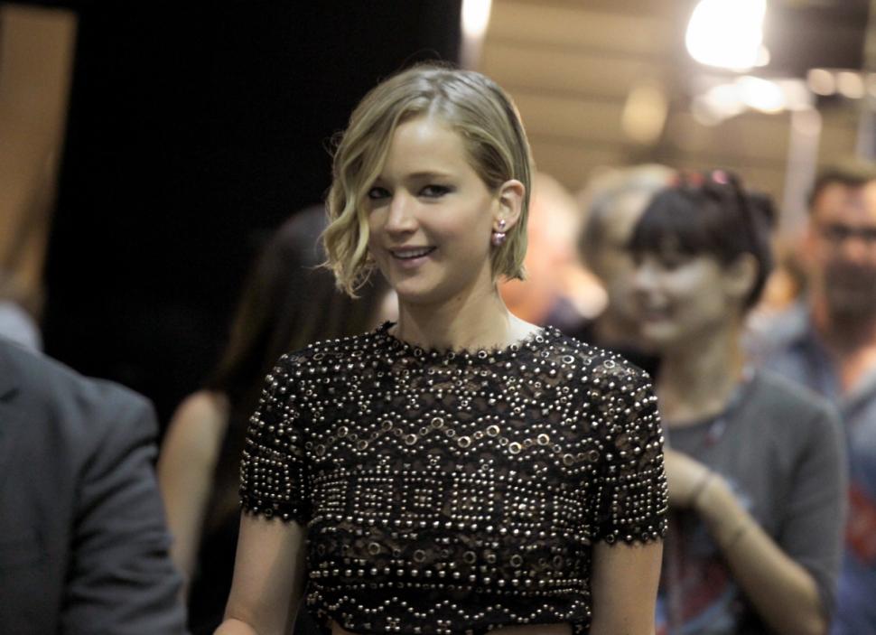 Actress Jennifer Lawrence flashes a smile at the iHeartRadio Music Festival Friday.