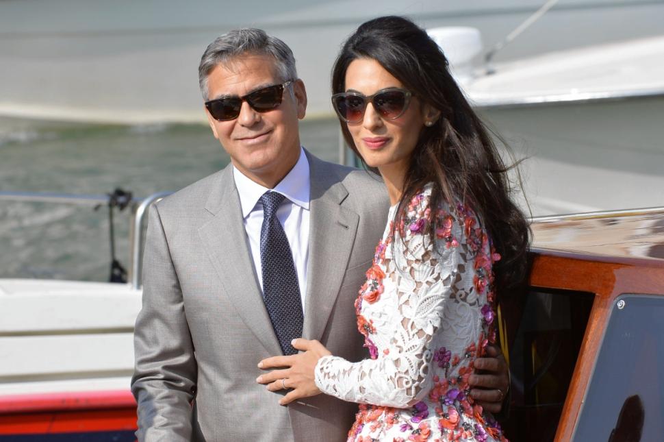 George Clooney and his wife Amal Alamuddin leave the Aman Hotel in Venice on September 28.
