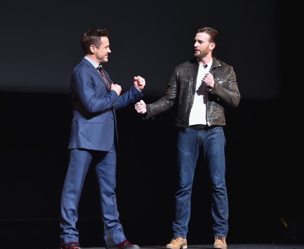 Robert Downey Jr. (l.) and Chris Evans onstage during Marvel Studios fan event in Los Angeles on Tuesday.