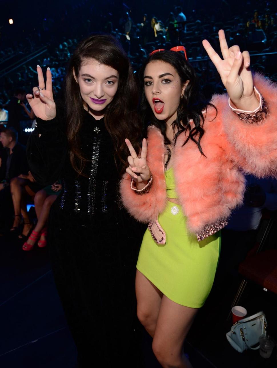British singer Charli XCX (right) crashed a Homecoming party Wednesday night. Also pictured is Lorde from when the two attended the 2014 MTV Video Music Awards in August.