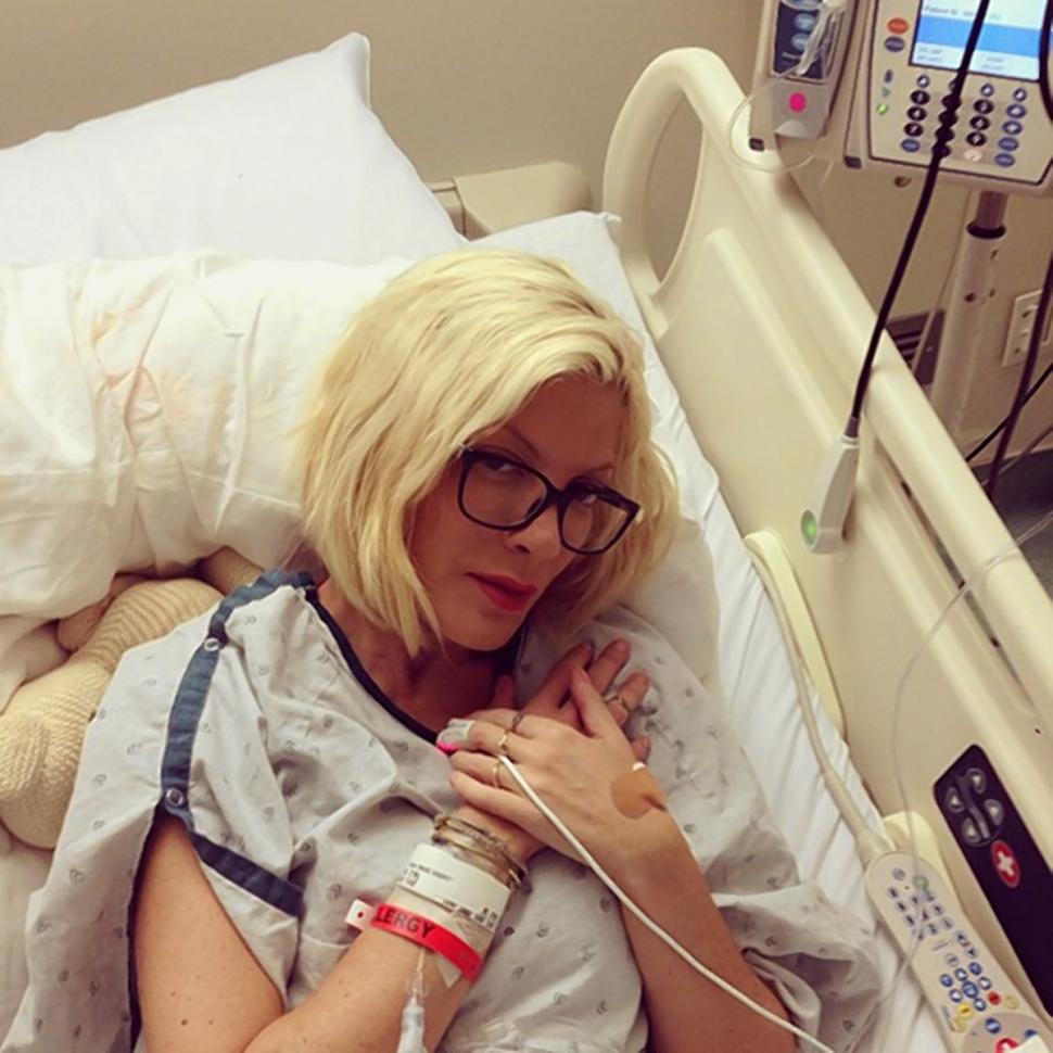 Things keep getting worse for Tori Spelling. First her husband, Dean McDermott, cheated on her, and now her own mother seems to have replaced her, too. Pictured is a photo Spelling posted on Instagram while in a hospital.