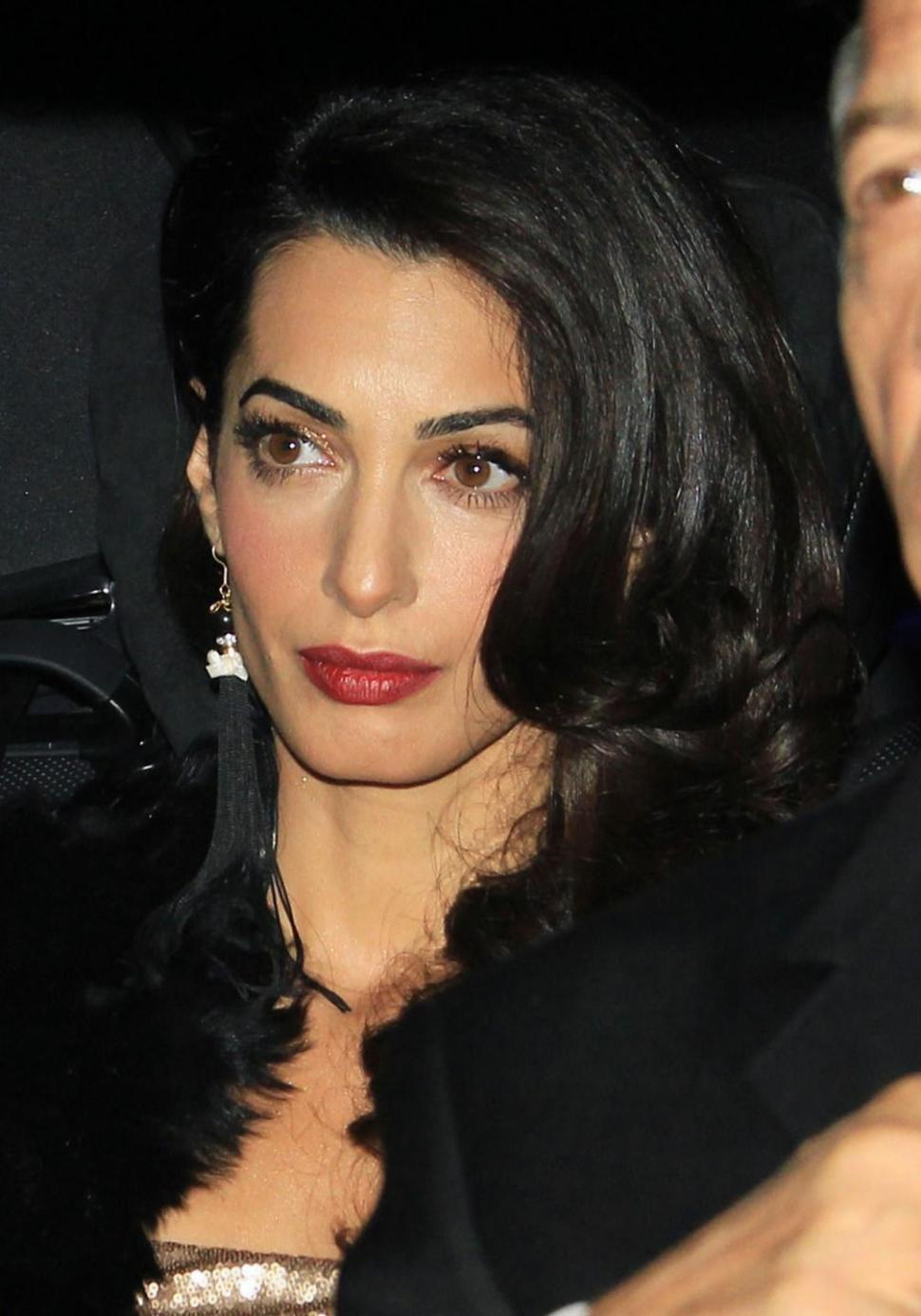 Amal Alamuddin heads with husband George Clooney to glittering party outside London, thrown by the bride’s parents to celebrate the couple’s recent marriage.