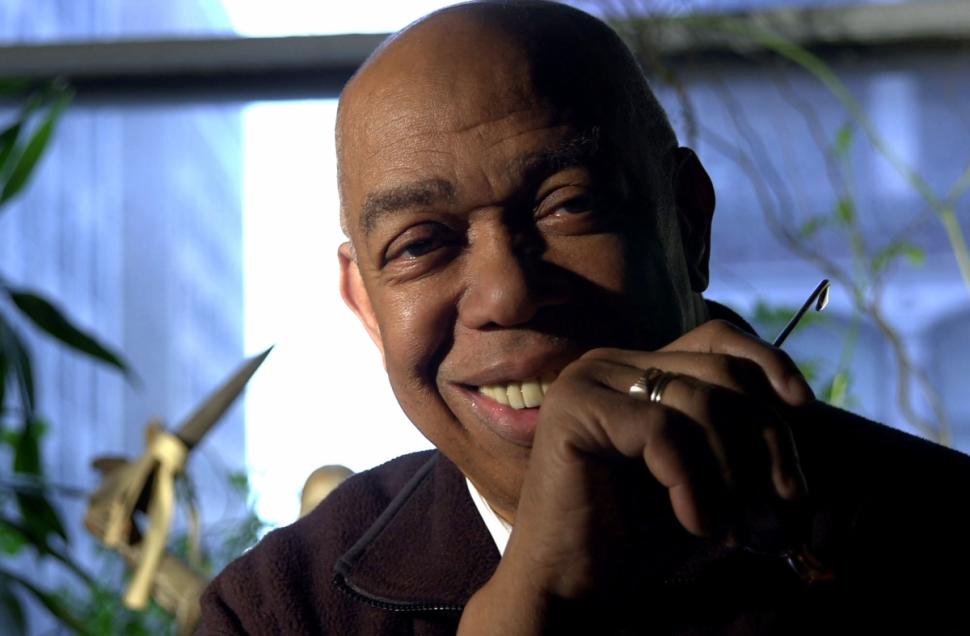 Geoffrey Holder smiles warmly in his Manhattan studio. The dancer, actor, painter and director died Sunday at 84.