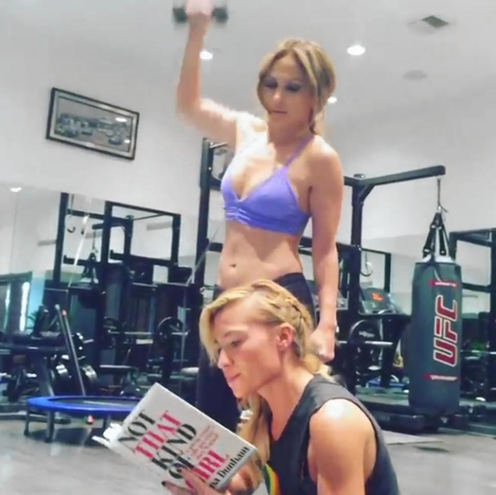 Jennifer Lopez says ‘Tracy?’ when she realizes her trainer has stopped working out and starts reading Lena Dunham’s new book.