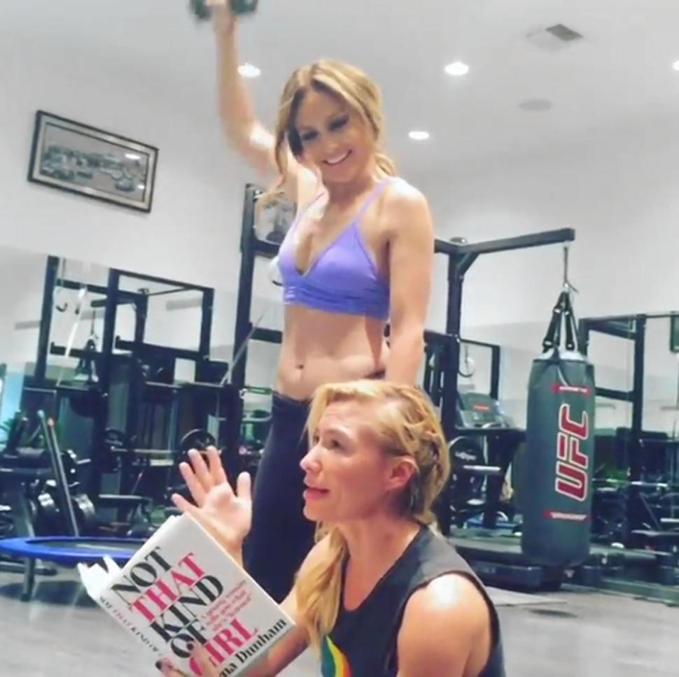 Tracy Anderson, Lopez’s personal trainer, apologizes for stopping mid work out to read Dunham’s book. ‘It’s so good I can’t put it down,’ she said.