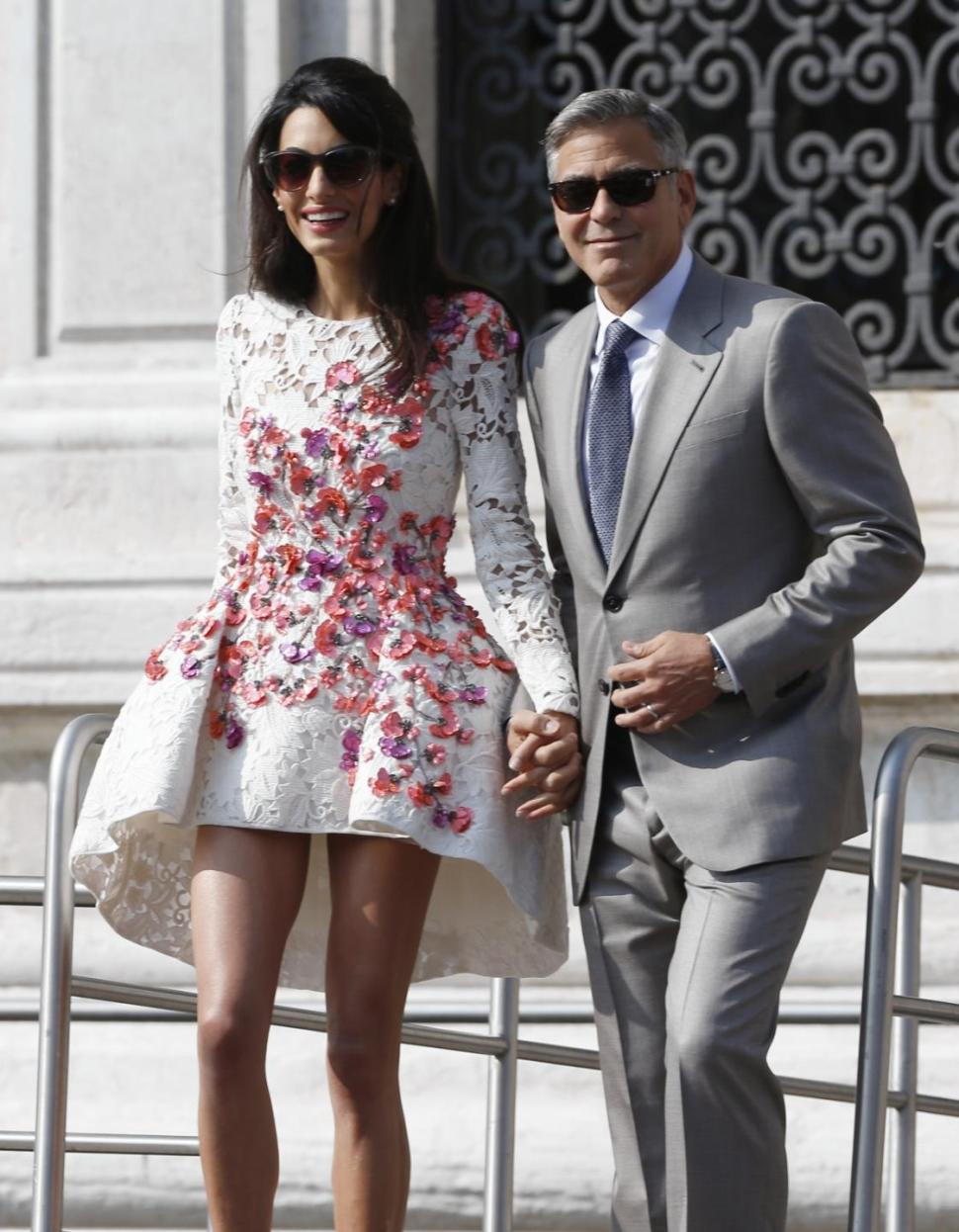 George Clooney and wife Amal leave luxury Hotel in Venice on Sunday, Sept. 28.
