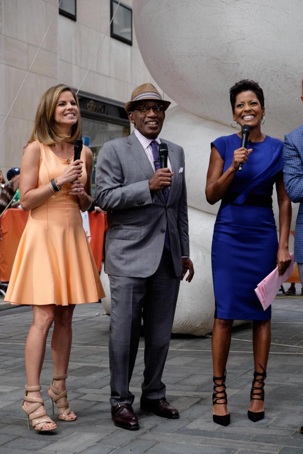 Al Roker (center) says he stays in shape by riding his bike around town.