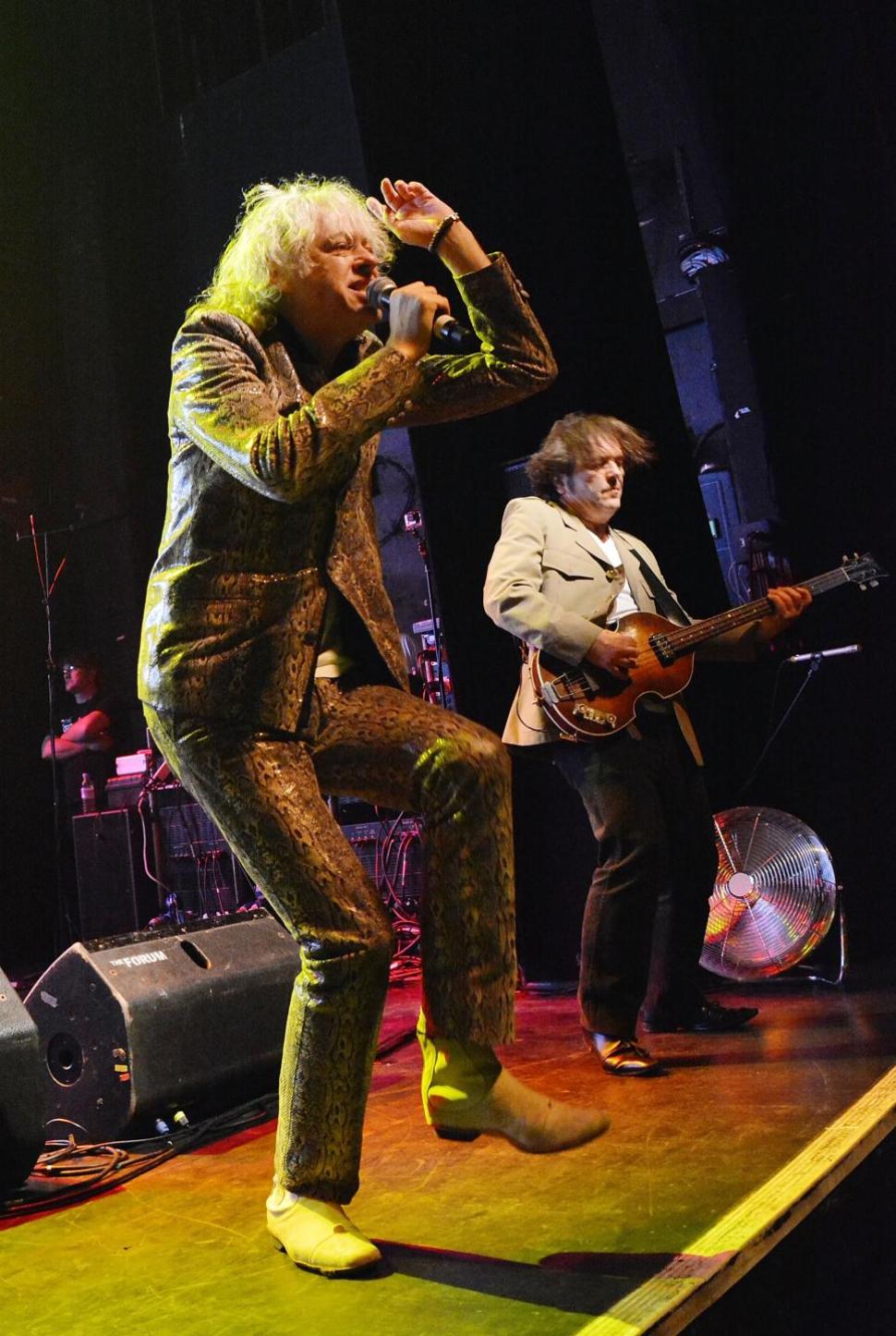 Sir Bob Geldof and Pete Briquette of The Boomtown Rats perform live on stage at The Kentish Town Forum on Nov. 7 in London, United Kingdom. Geldof has recruited a new set of singers for the 2014 version of ‘Do They Know It’s Christmas?’ to help combat Ebola.