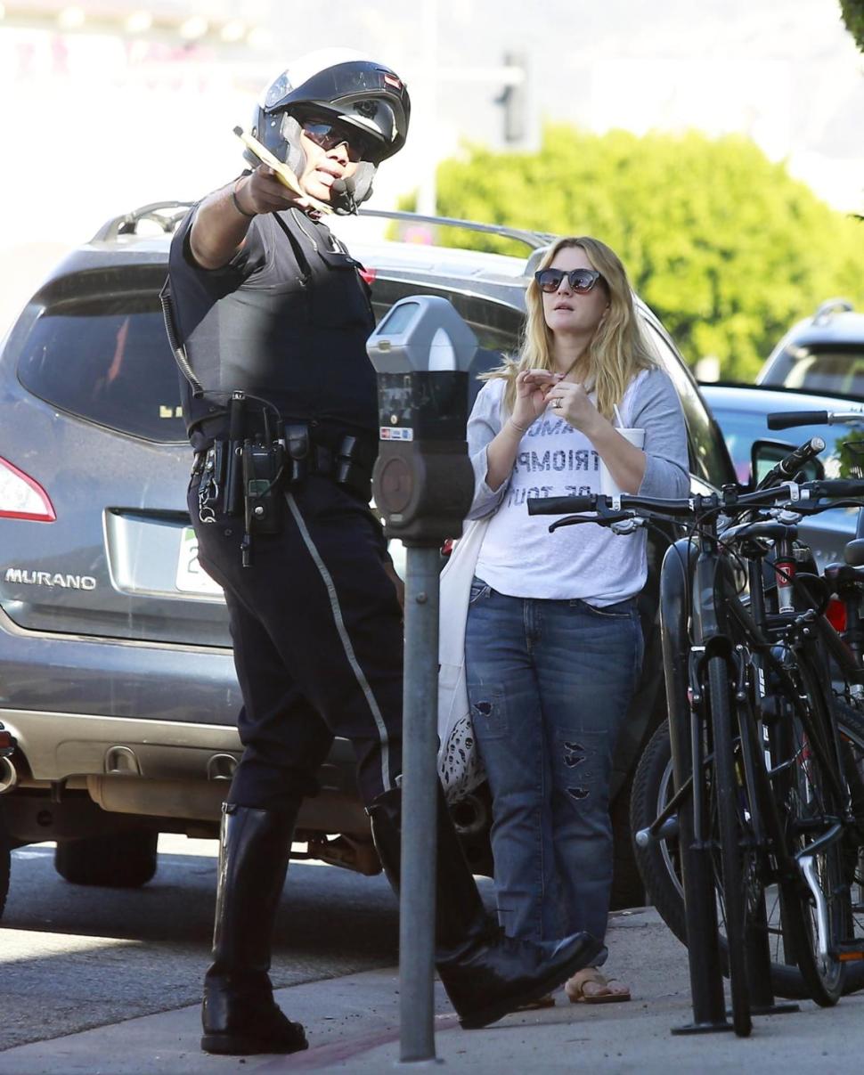 The mother of two is seen speaking with an officer after getting stopped in Beverly Hills.