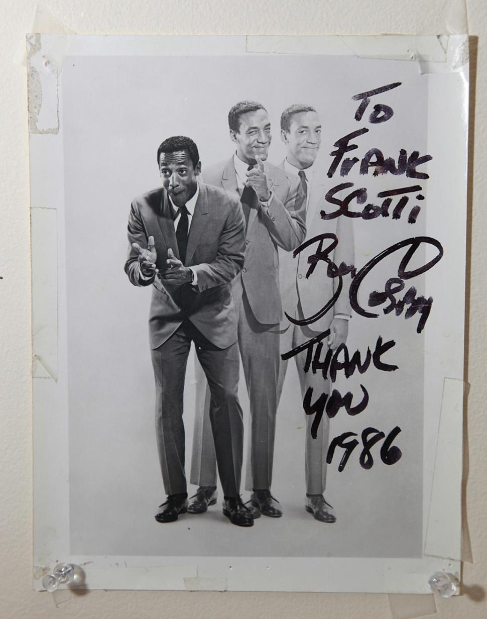 A photo signed by Bill Cosby hangs inside the home of 90-year-old Frank Scotti.