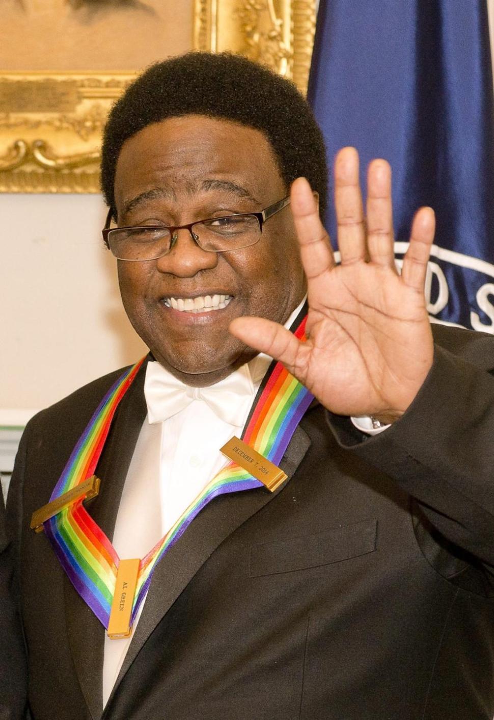 Singer Al Green waves to the audience during Sunday's event.