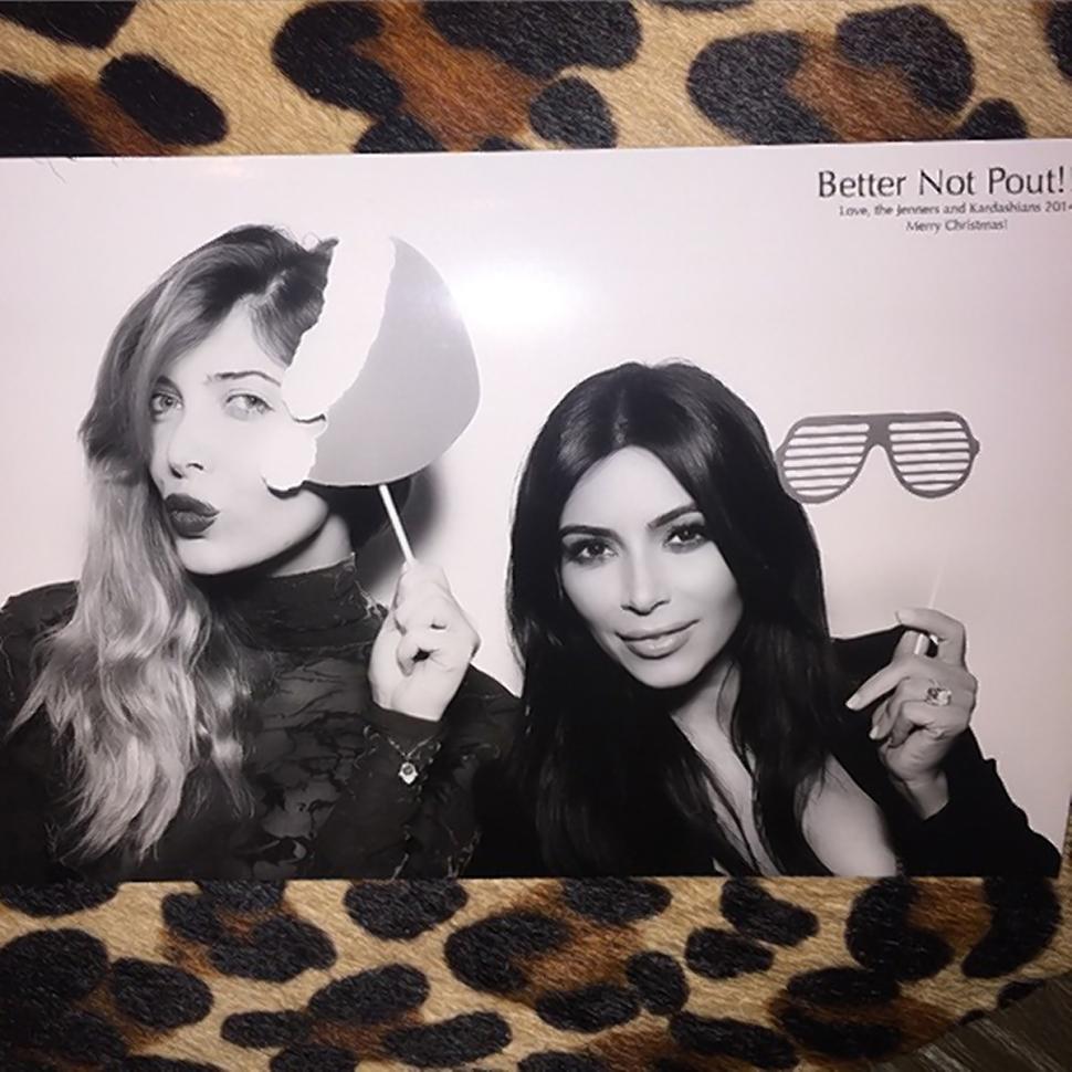 Brittny Gastineau with Kim Kardashian in Christmas Eve photo booth shot proving Kim did not jet to Paris for the holidays.