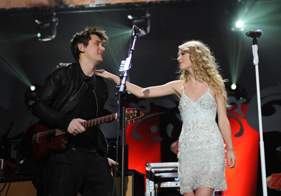 John Mayer and Taylor Swift perform onstage during Z100's Jingle Ball in 2009.