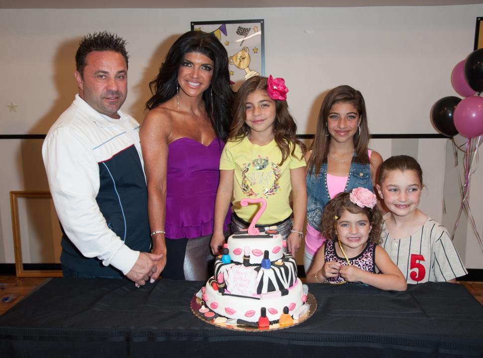 Joe and Teresa Giudice with their children at daughter Milania's 7th birthday celebration in New Jersey in 2013.