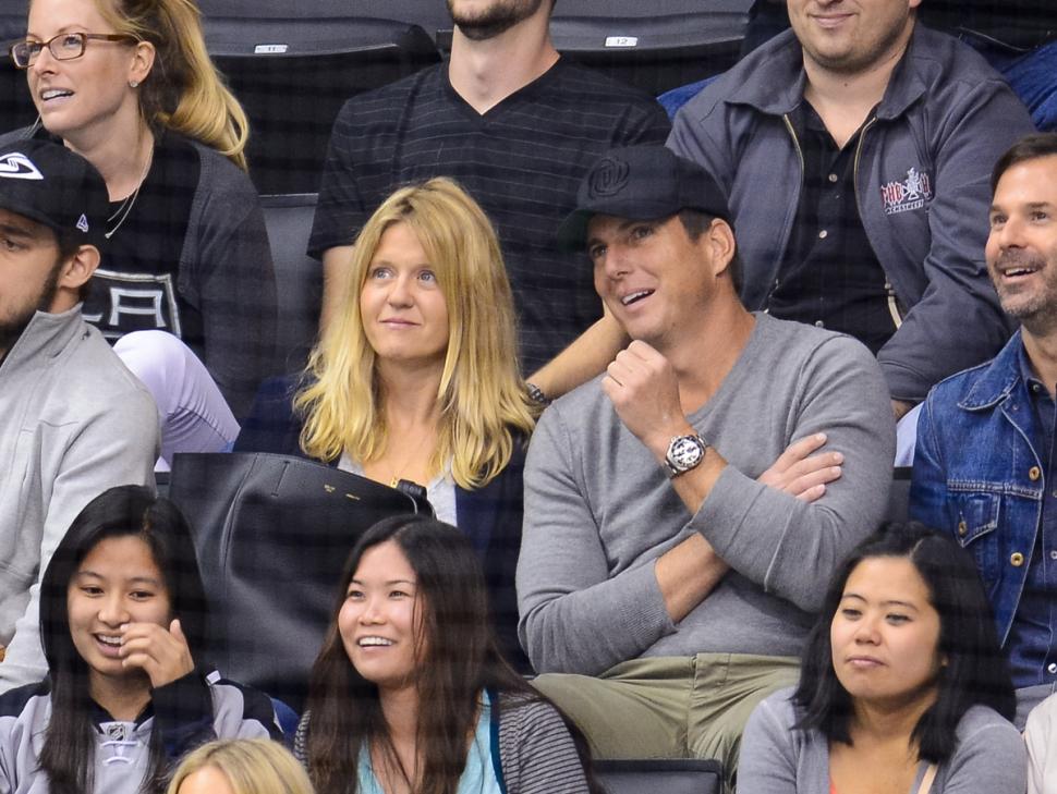 Will Arnett (R) and Erin David attend a hockey game between the Toronto Maple Leafs and the Los Angeles Kings at Staples Center on March 13, 2014 in Los Angeles.