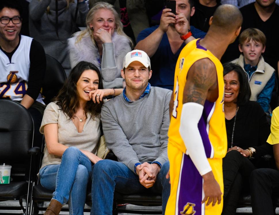 Mila Kunis sported a suspicious looking band next to her engagement ring at a Lakers game last month. Kutcher, however, wasn't rocking any hardware.