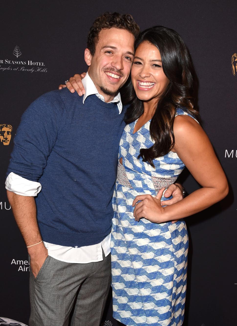 Actors Henri Esteve (L) and Gina Rodriguez attend the 2015 BAFTA Tea Party at The Four Seasons Hotel on January 10 in Beverly Hills, California. 