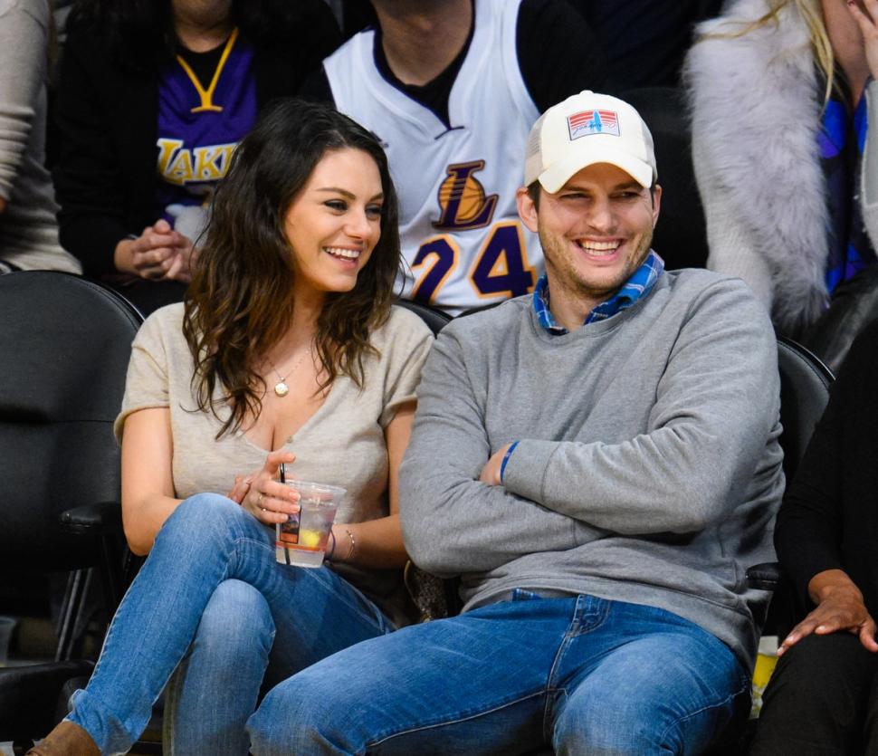 Mila Kunis and Ashton Kutcher at a Lakers game in Los Angeles on Dec. 19.