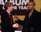 Musician Beck (L) and Kanye West speak onstage during The 57th Annual GRAMMY Awards.