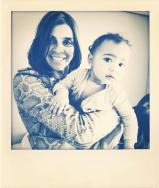 Carine Roitfeld holds North West on Instagram.