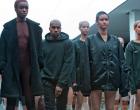 Kanye West, second left, appears with models during the showing of the Kanye West Adidas Fall 2015 collection on Thursday.