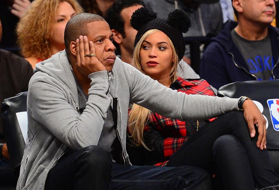 Jay Z, shown with his wife, Beyoncé, at a Brooklyn Nets game last year, is reportedly facing a civil suit in New Jersey from a 21-year-old man who claims the megastar is his father.