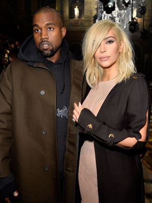 Kim Kardashian flaunts her ample cleavage in mesh dress and continues to flash her platinum blonde hues [Getty]