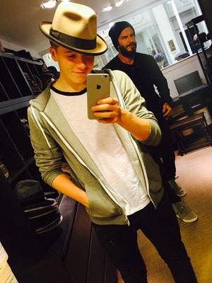 David Beckham photobombs teen Brooklyn in what now appears to be the most perfect father-and-son selfie [Instagram]
