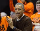 President Barack Obama cheers at the Princeton game against Wisconsin-Green Bay women's college basketball game in the first round of the NCAA tournament in College Park, Md., Saturday, March 21, 2015. Obama's niece Leslie Robinson, plays for Princeton.(AP Photo/Pablo Martinez Monsivais)