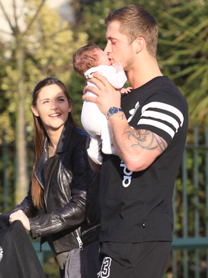 Dan Osborne showers baby Ella in kisses during family stroll with Jacqueline Jossa [Wenn]