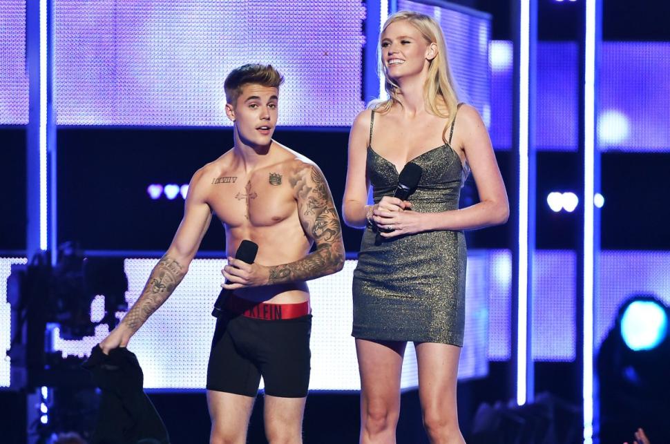 Justin Bieber and model Laura Stone present onstage at Fashion Rocks at the Barclays Center in Brooklyn.