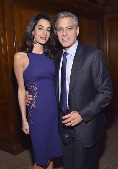 George Clooney joined wife Amal (pictured at an NYC event on March 10) and his mom for dinner Monday night.