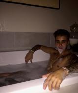 Justin Bieber shares a photo of himself taking a bubble bath.