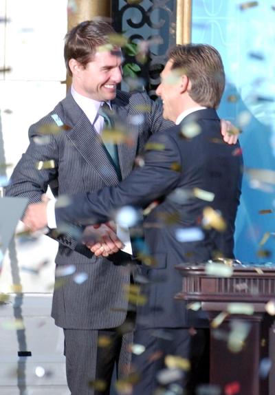 Tom Cruise (l.) embraces David Miscavige, the Scienology Church's President of the Rulling Council, during a 2004 event.