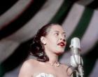 Jazz and blues singer Billie Holiday performs at the Newport Jazz festival in 1957.