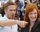 Canadian actor Ryan Gosling (L) gestures while posing with US actress Christina Hendricks during a photocall for the film "Lost River" at the 67th edition of the Cannes Film Festival in Cannes, southern France, on May 20, 2014. AFP PHOTO / LOIC VENANCELOIC VENANCE/AFP/Getty Images