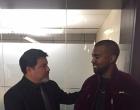Kanye West (right) apologizes to Daniel Ramos (left) as part of the settlement of the photographer’s lawsuit against the star rapper.