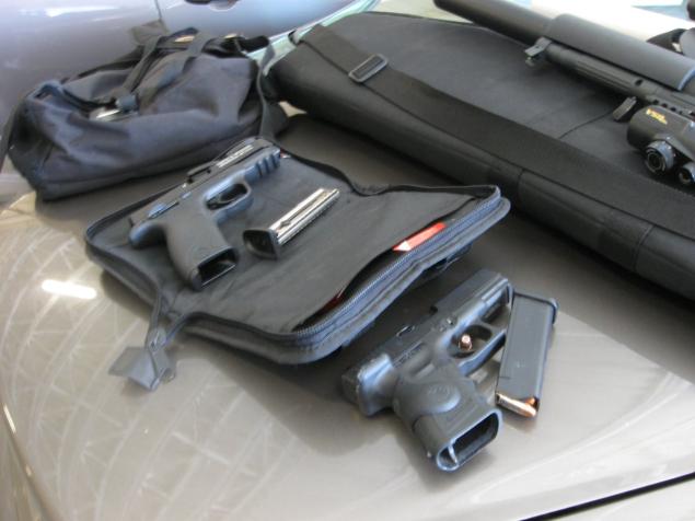 Photos of guns and license plates found in the rental car of Florida private investigator Dwayne Powell, 42.