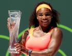 KEY BISCAYNE, FL - APRIL 04: Serena Williams poses with the Butch Buchholz Trophy after defeating Carla Suarez Navarro of Spain during the final on day 13 of the Miami Open Presented by Itau at Crandon Park Tennis Center on April 4, 2015 in Key Biscayne, Florida. (Photo by Matthew Stockman/Getty Images)