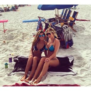 Kim Zolciak posted a beach day photo Friday of her and 18-year-old daughter Brielle, writing: "Me and my mini."